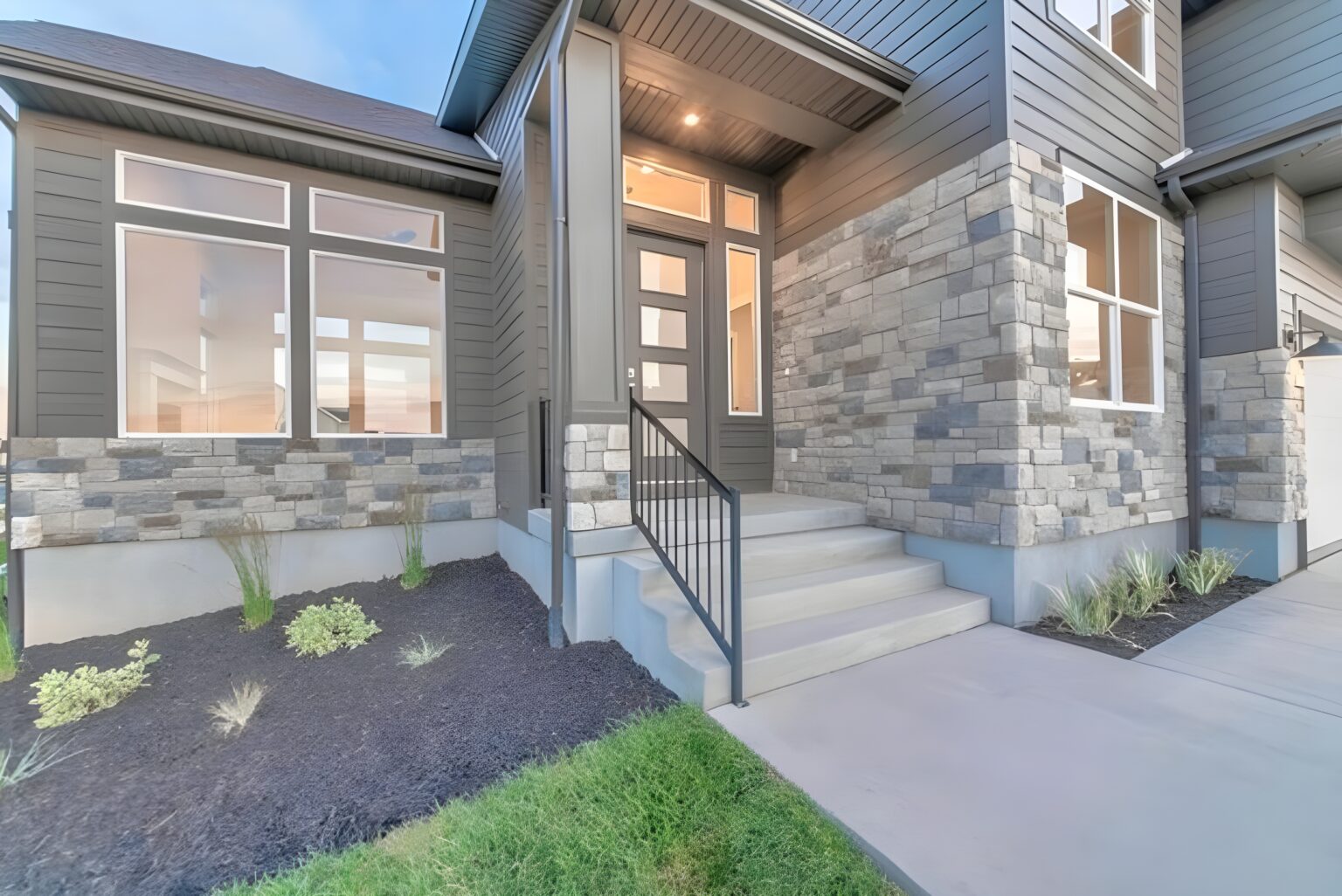 Modern home entrance with stone accents. Exterior home remodeling in New London County, CT