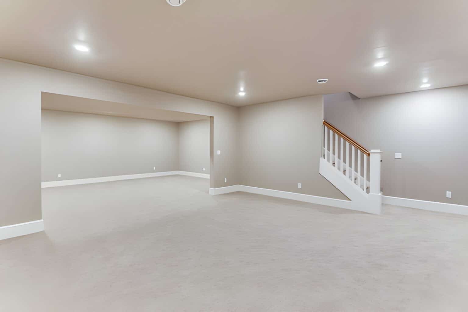 Empty, spacious, well-lit basement area. Basement remodeling in New London County, CT